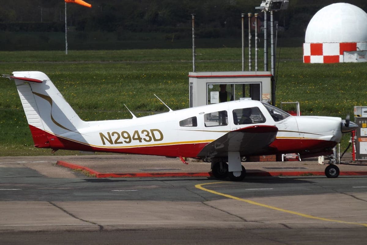 Piper Arrow retractable-gear aircraft parked on the ramp